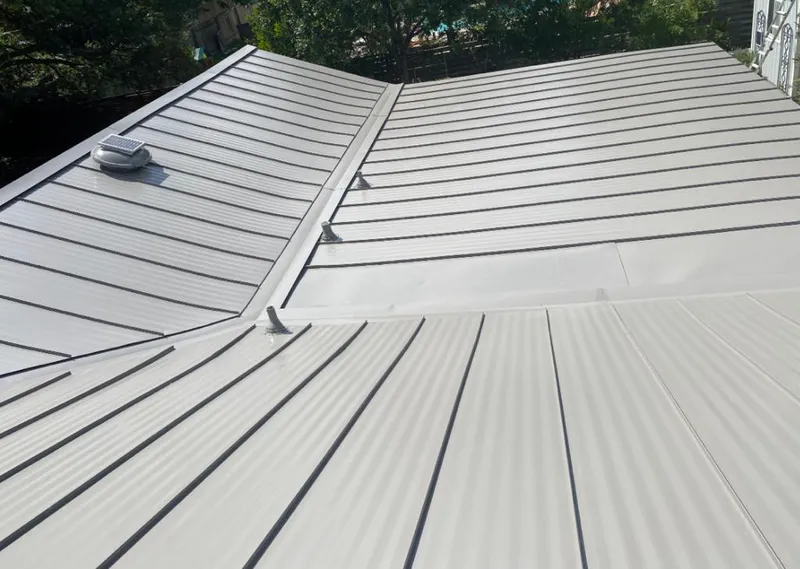 Solar attic fan installed on a metal roof for Roof Ventilation in Gardena